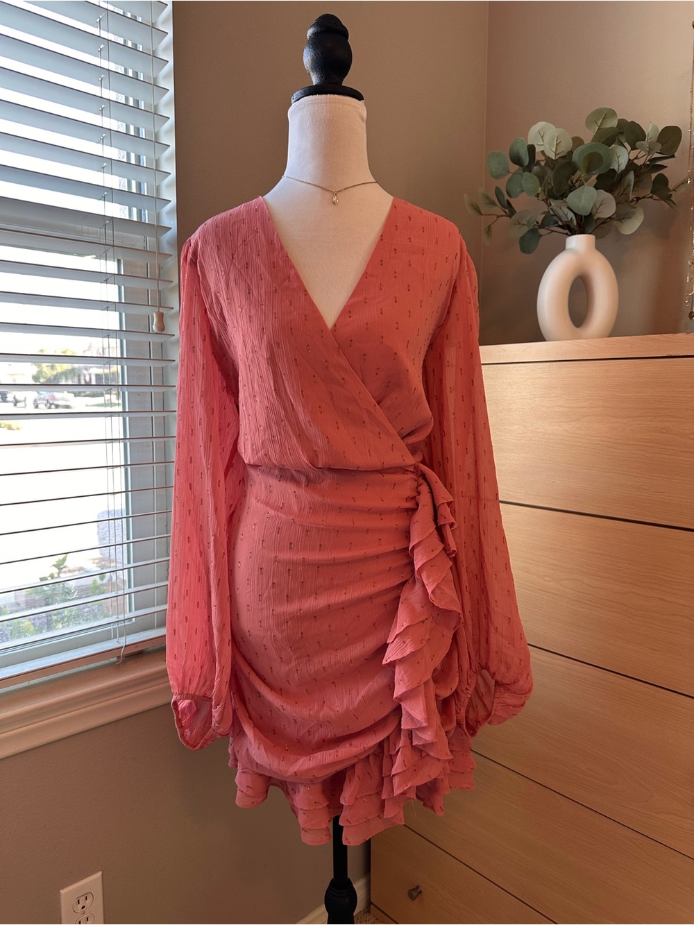 Express Coral Pink Long Sleeve Ruffle Wrap Dress with gold details.